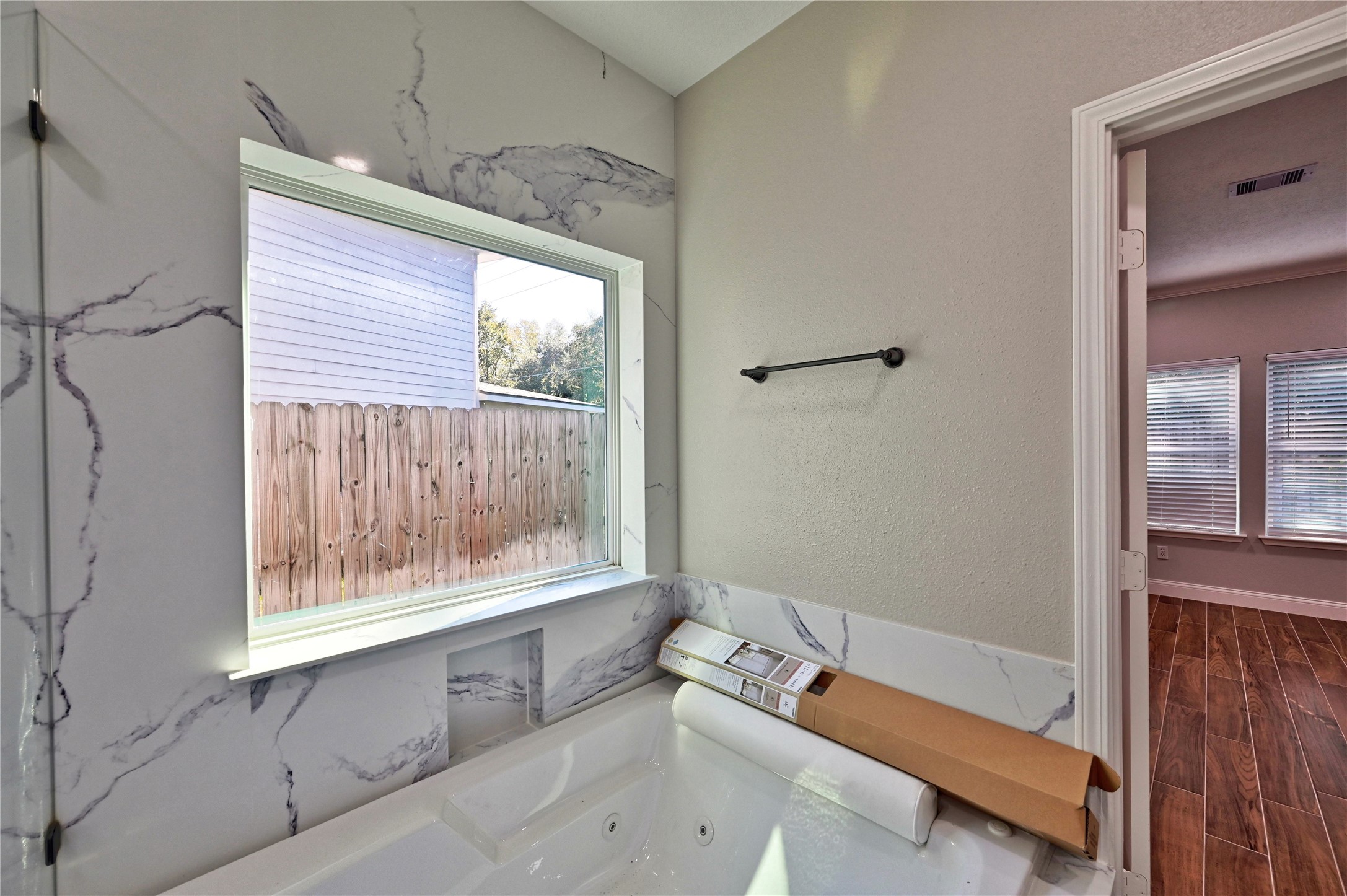 17907 Pelican Way Road Houston, TX 77084 - Photo 20 of 38 a bathroom with a bathtub and a window