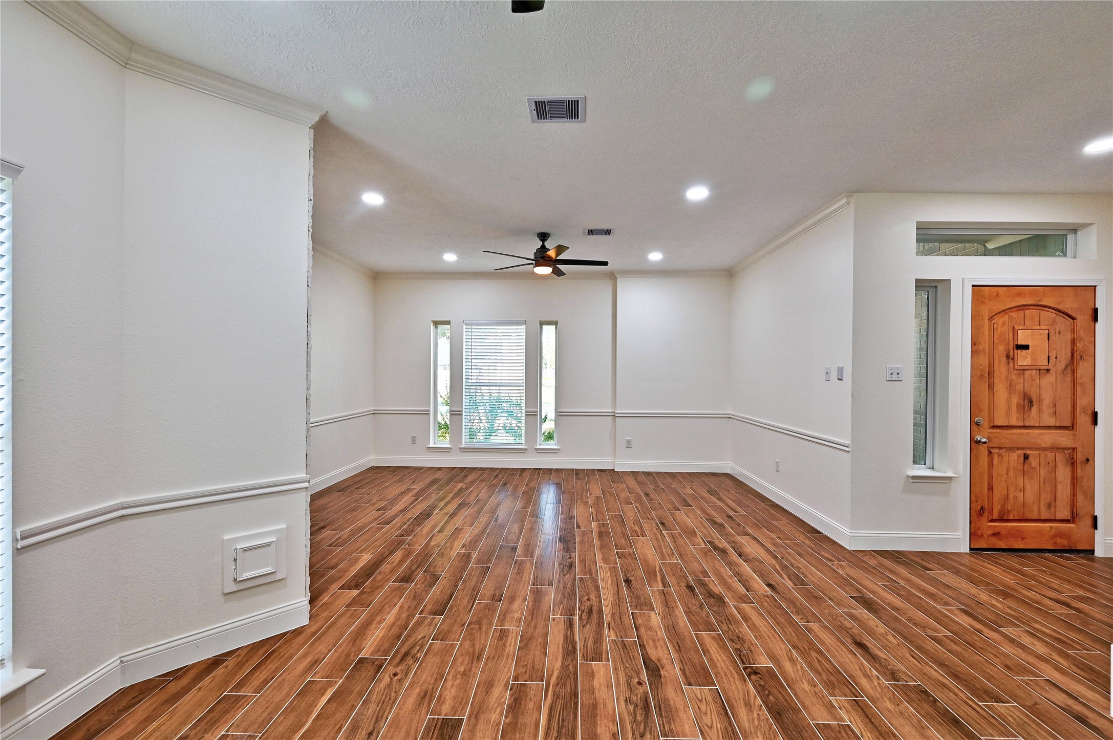 17907 Pelican Way Road Houston, TX 77084 - Photo 5 of 38 a view of an empty room and wooden floor