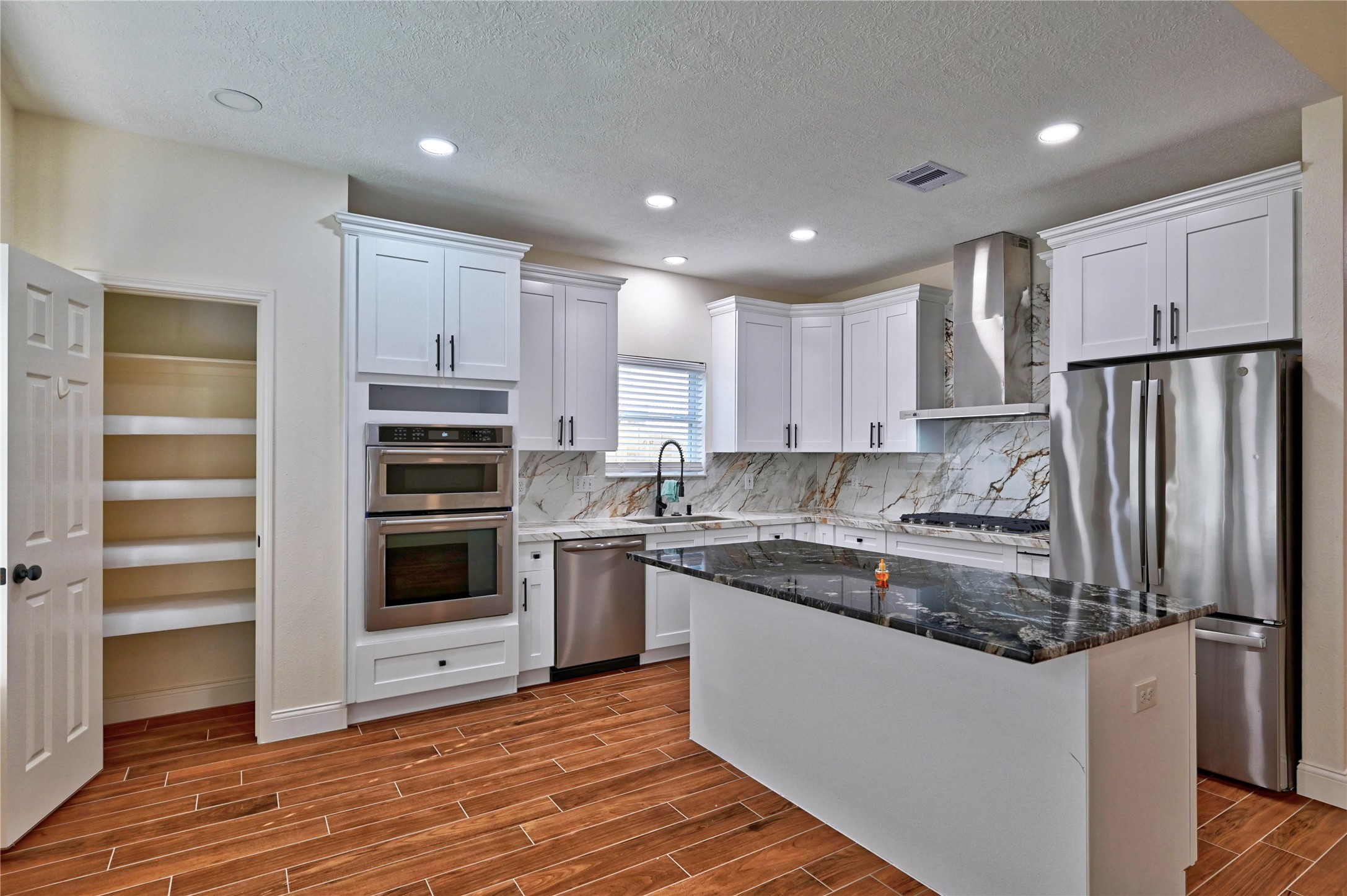 17907 Pelican Way Road Houston, TX 77084 - Photo 10 of 38 a kitchen with stainless steel appliances granite countertop a refrigerator and a stove top oven