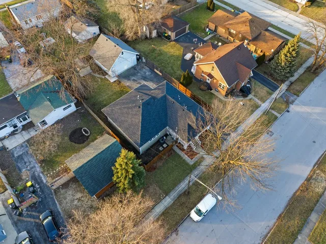 an aerial view of a house with a garden