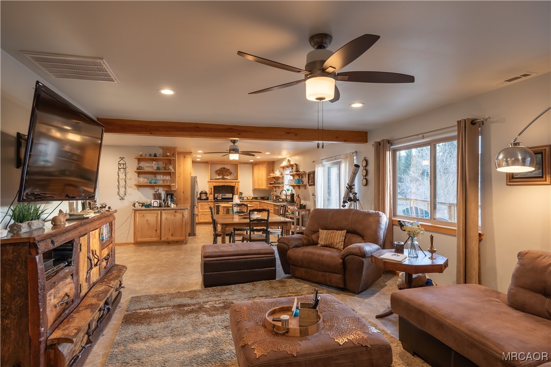 448 Edgemoor Road Big Bear Lake, CA 92315 - Photo 10 of 42 a living room with furniture and a flat screen tv