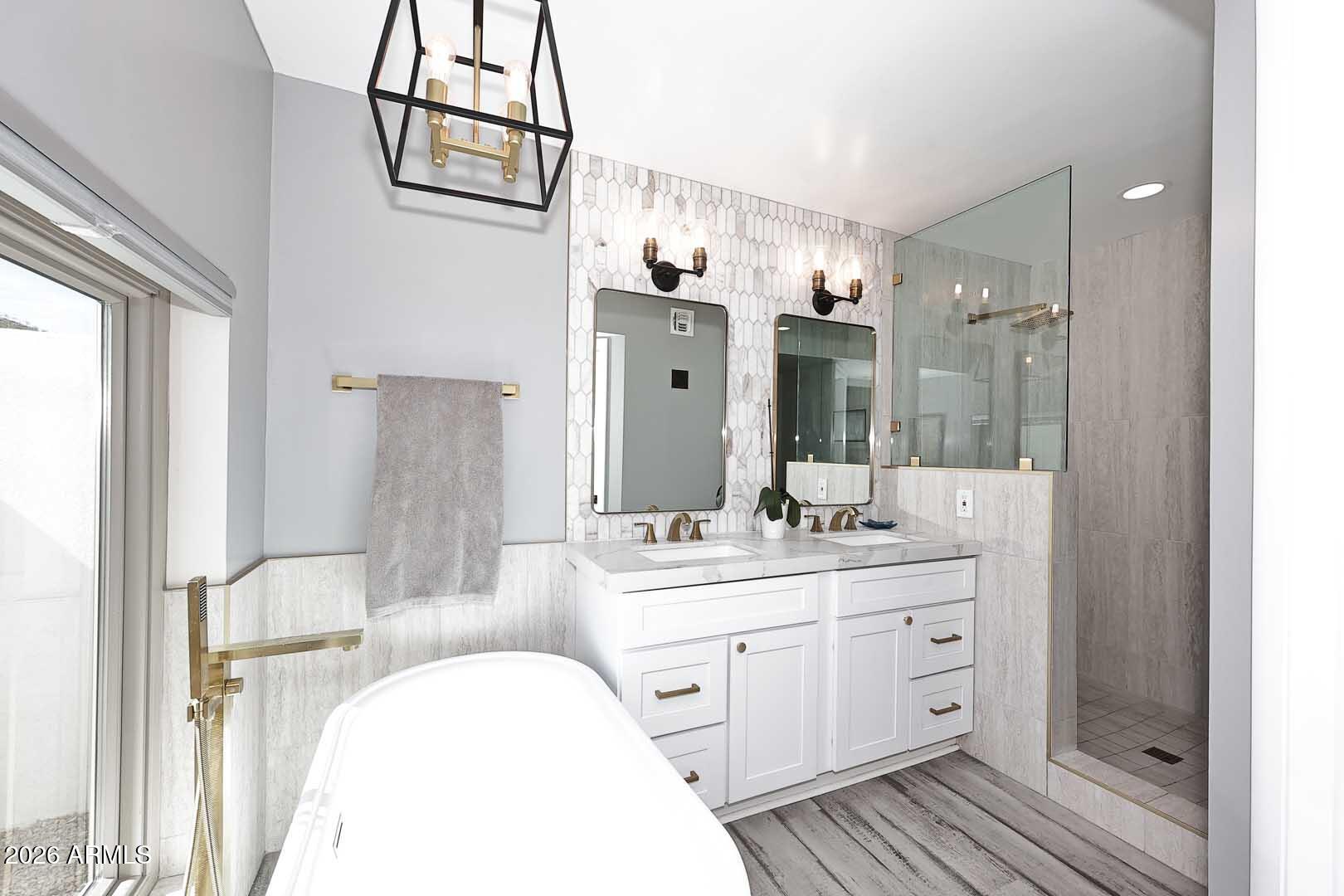 4641 East Mountain View Road Phoenix, AZ 85028 - Photo 15 of 44 a bathroom with a double vanity sink mirror and shower