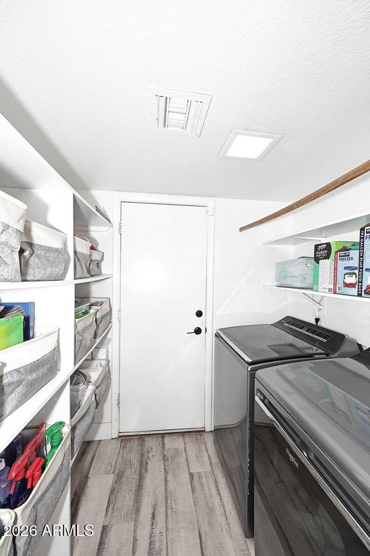 4641 East Mountain View Road Phoenix, AZ 85028 - Photo 29 of 44 a kitchen with a sink and a refrigerator