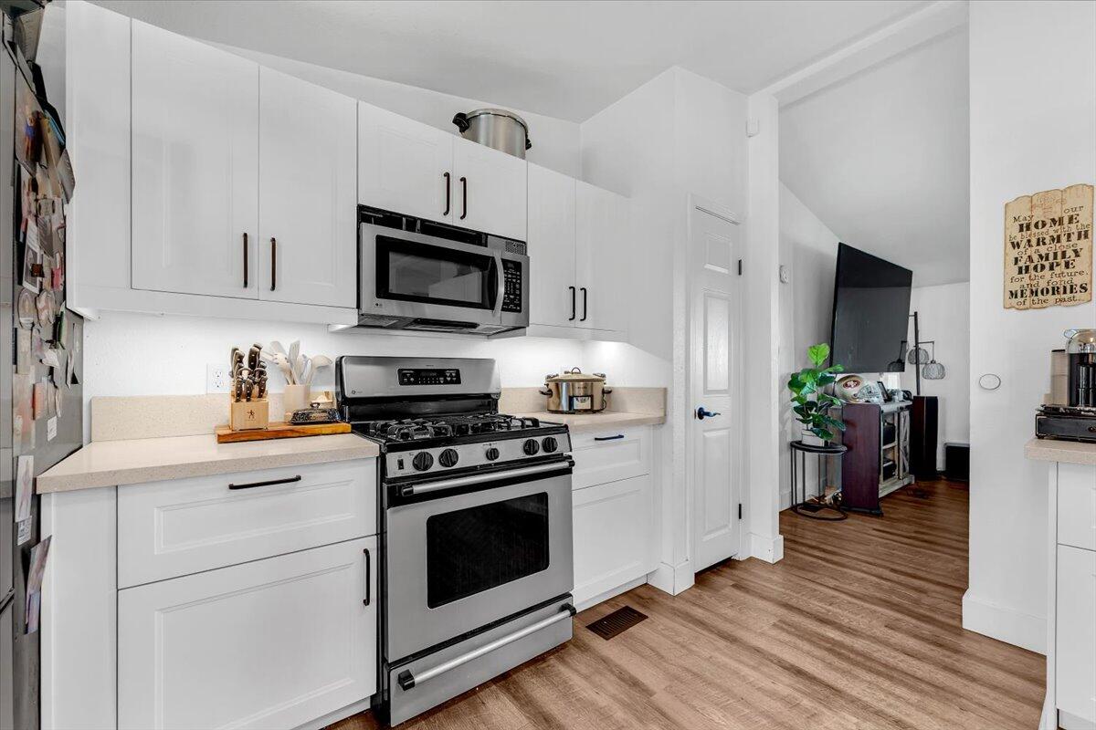 23504 Dersch Road Anderson, CA 96007 - Photo 14 of 54 a kitchen with stainless steel appliances a stove microwave and sink