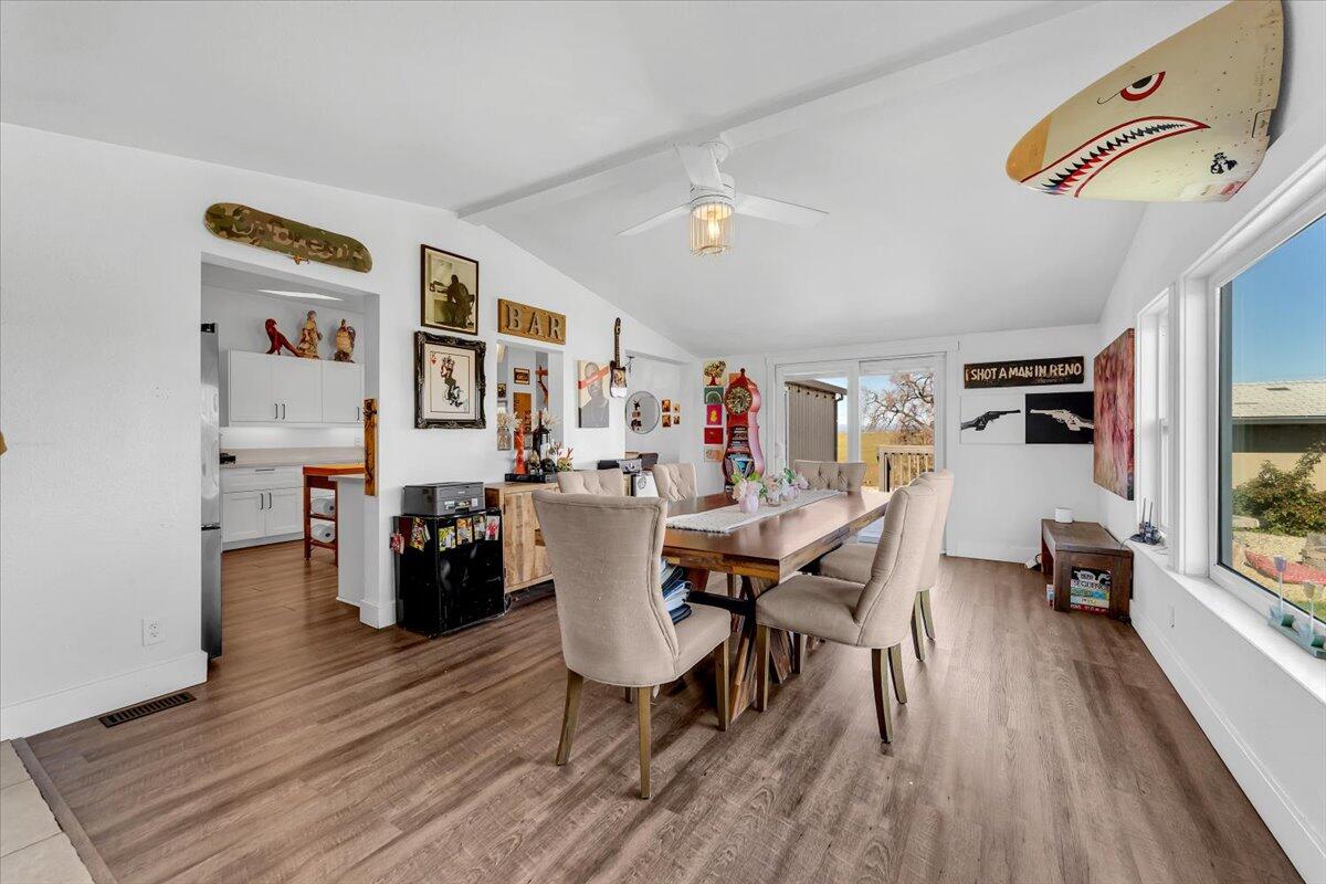 23504 Dersch Road Anderson, CA 96007 - Photo 18 of 54 a dining room with furniture and wooden floor