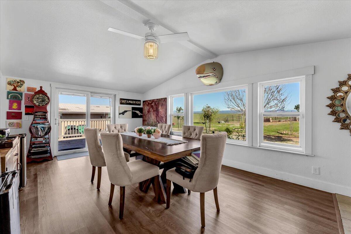 23504 Dersch Road Anderson, CA 96007 - Photo 19 of 54 a view of a dining room with furniture and a large window