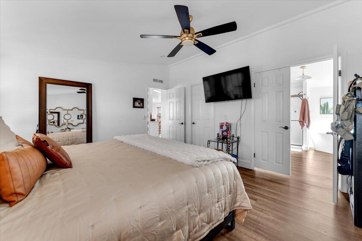 23504 Dersch Road Anderson, CA 96007 - Photo 24 of 54 a bedroom with a bed and a flat screen tv