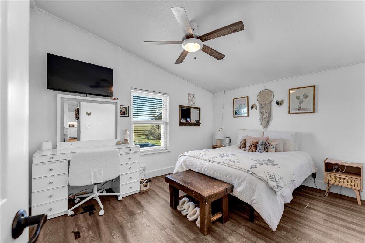 23504 Dersch Road Anderson, CA 96007 - Photo 28 of 54 a bedroom with a bed window and a flat screen tv