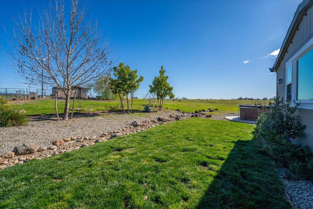 23504 Dersch Road Anderson, CA 96007 - Photo 33 of 54 a view of a garden with an outdoor space
