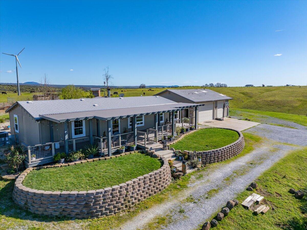 23504 Dersch Road Anderson, CA 96007 - Photo 35 of 54 a view of a house with a swimming pool and a yard