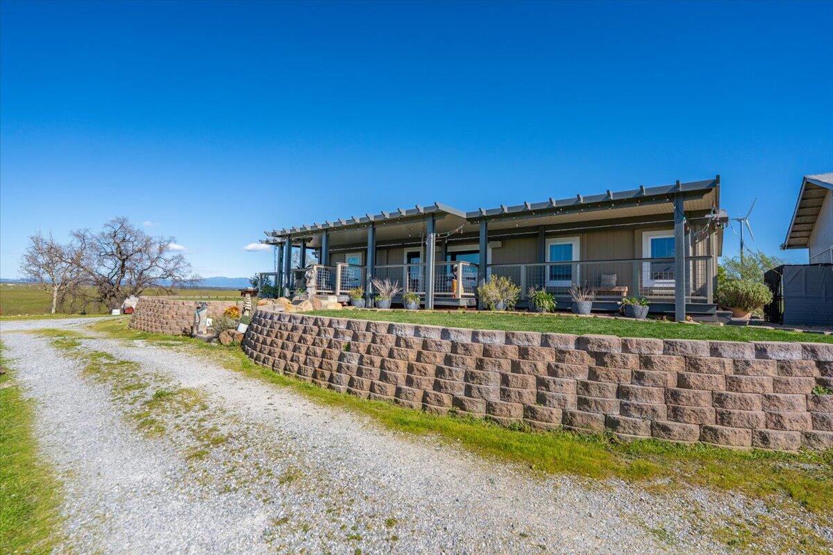 23504 Dersch Road Anderson, CA 96007 - Photo 51 of 54 a front view of a house with a garden