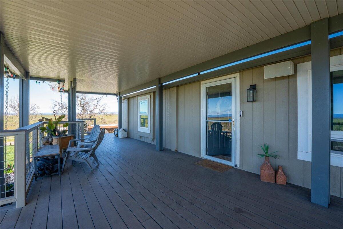 23504 Dersch Road Anderson, CA 96007 - Photo 53 of 54 a view of a porch with wooden floor and chairs