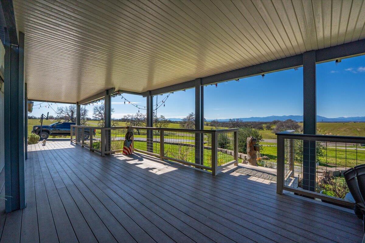 23504 Dersch Road Anderson, CA 96007 - Photo 9 of 54 an empty room with sliding door and wooden floor