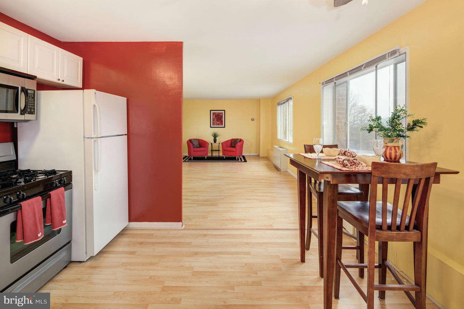 1300 South Arlington Ridge Road, Unit 304 Arlington, VA 22202 - Photo 10 of 19 a view of a dining room with furniture window and outside view