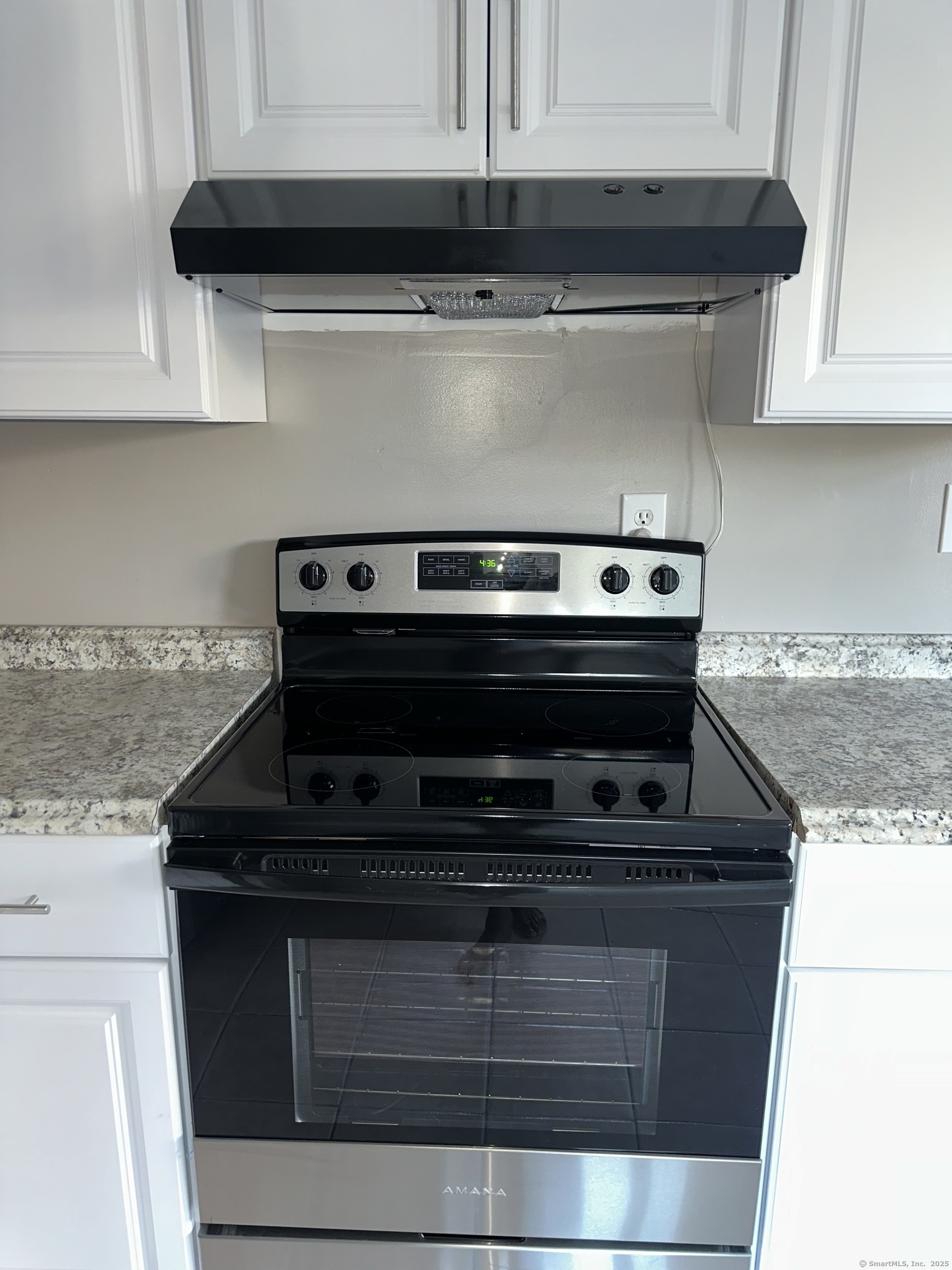 466 Merritt Street Bridgeport, CT 06606 - Photo 11 of 12 a stove top oven sitting inside of a kitchen