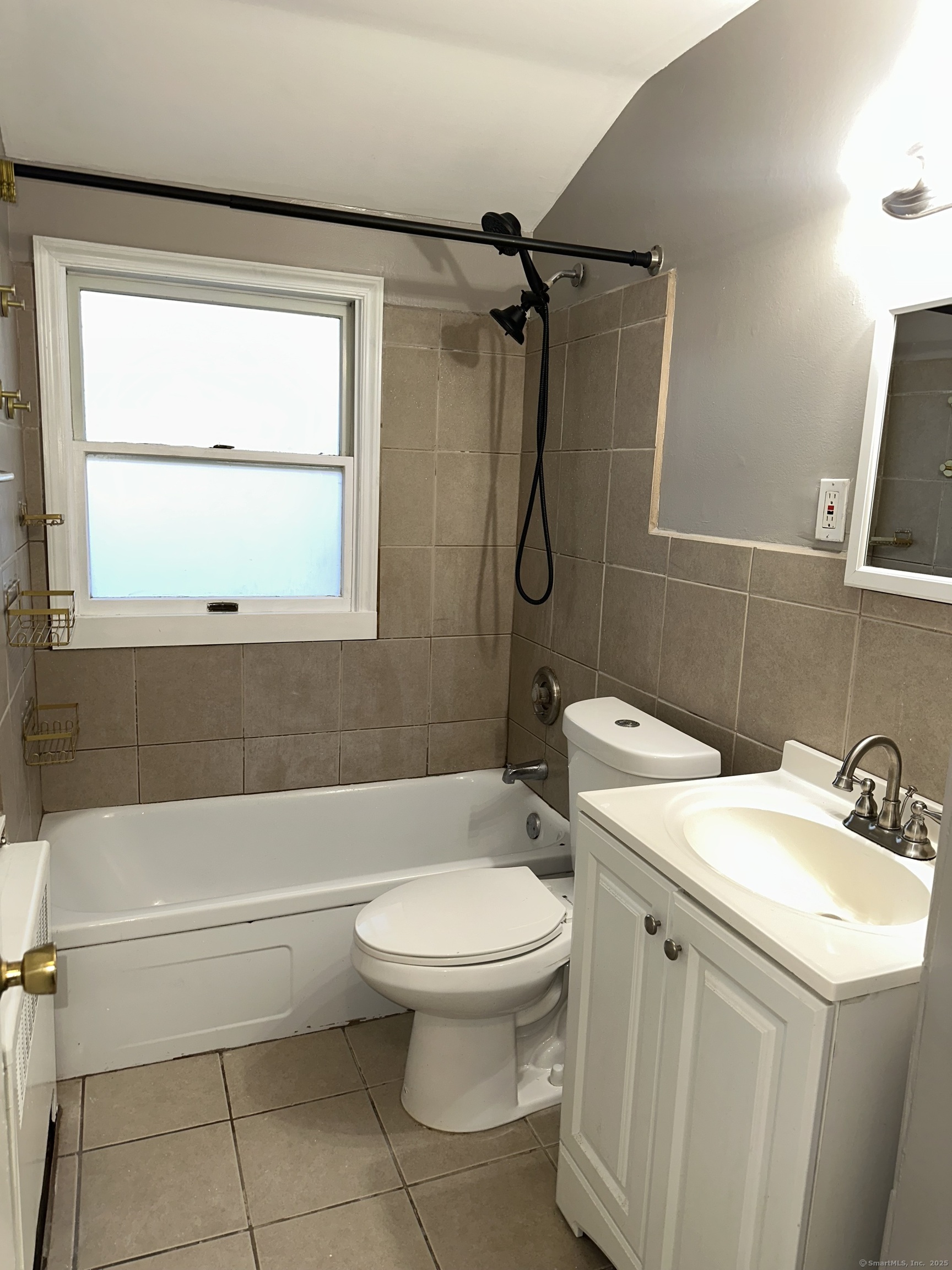 466 Merritt Street Bridgeport, CT 06606 - Photo 6 of 12 a bathroom with a toilet sink and shower