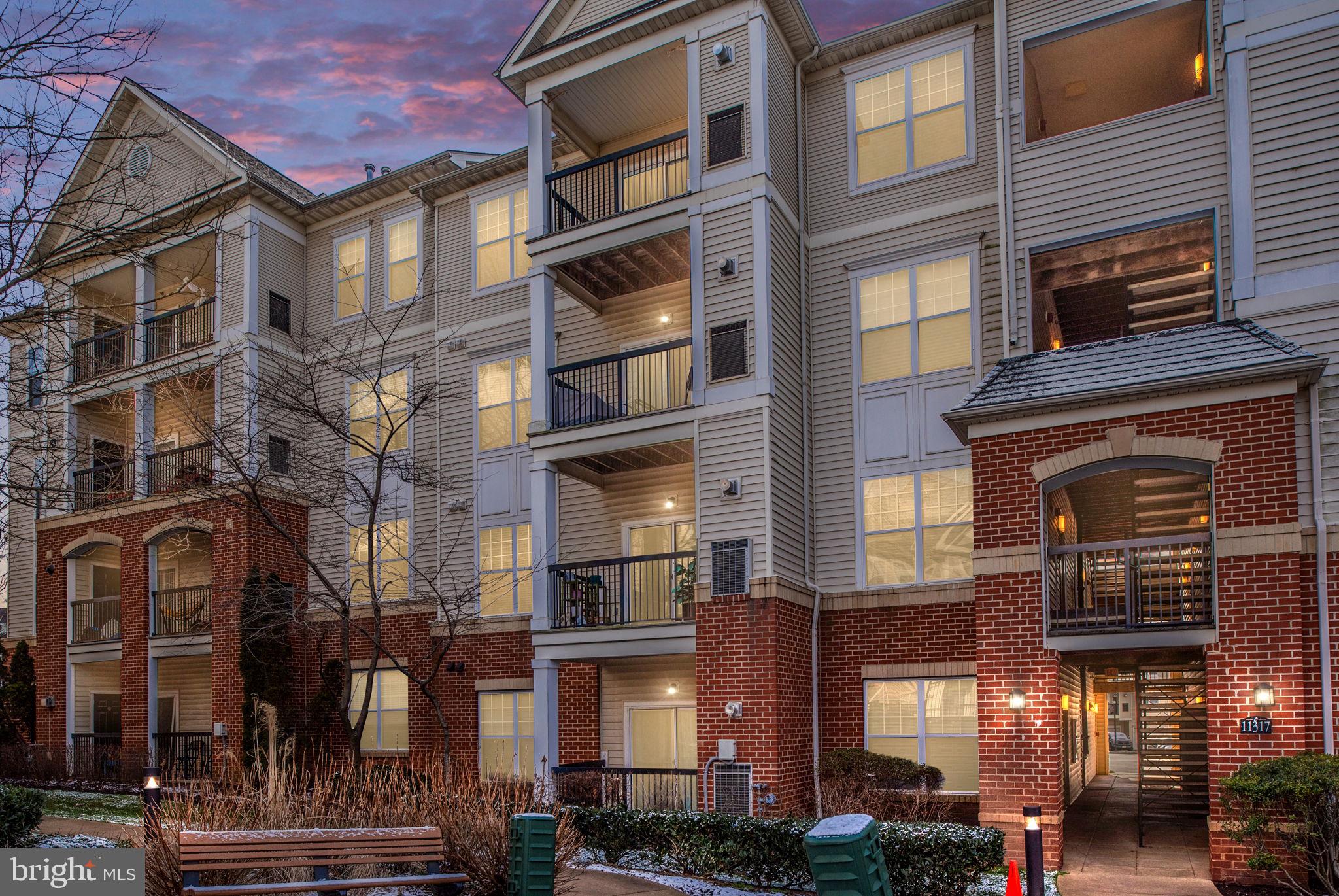 11317 Aristotle Drive, Unit 411 Fairfax, VA 22030 - Photo 1 of 35 a front view of a multi story building