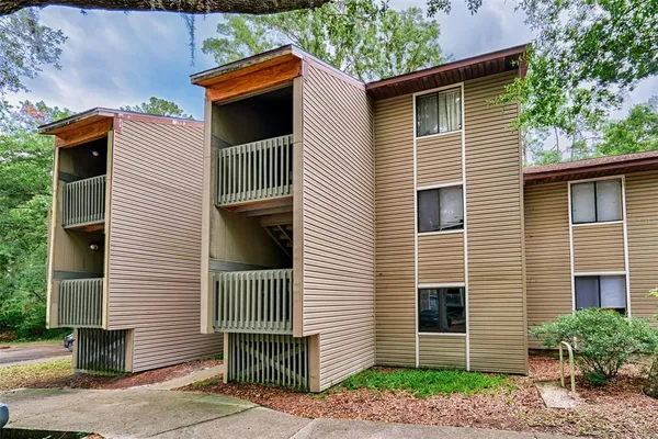 a view of a house and a yard