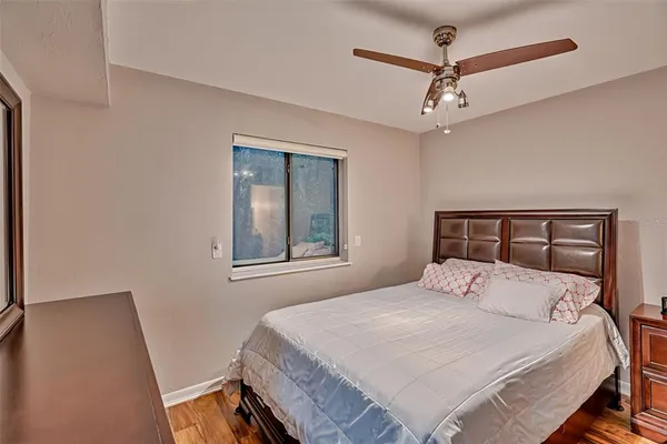 a bathroom with a granite countertop sink a mirror a shower and a bathtub