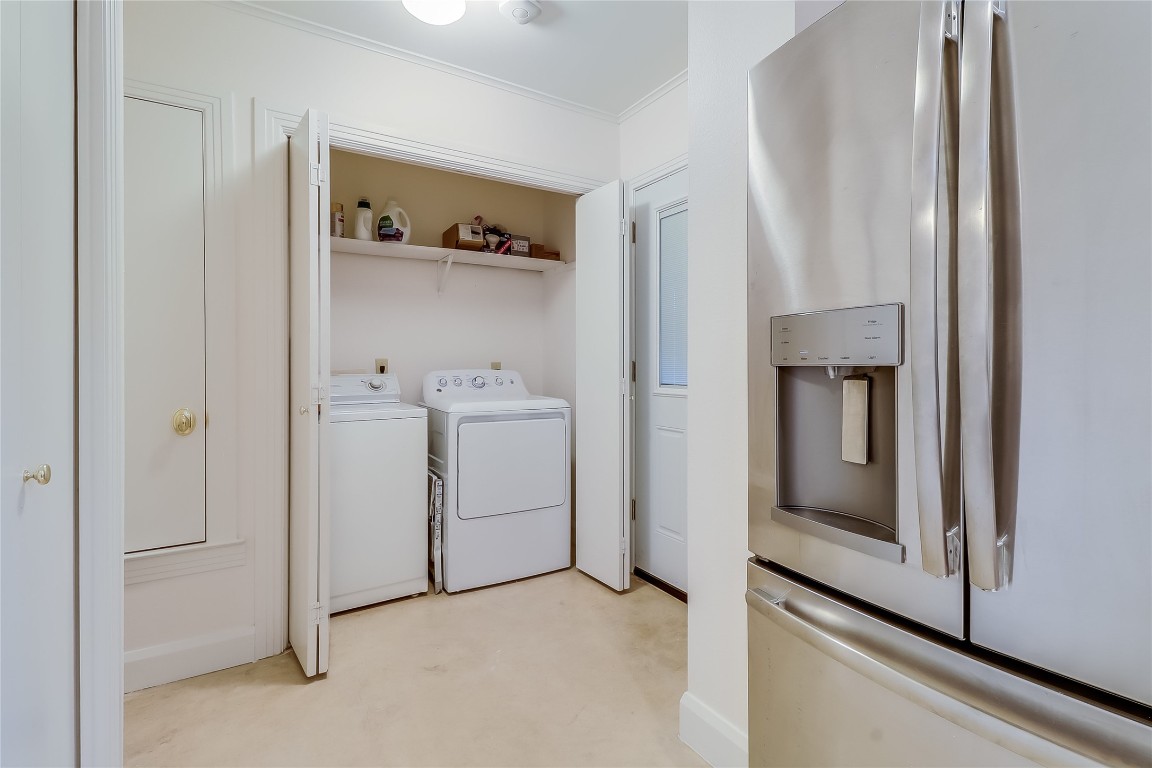 803 Rutherford Place Austin, TX 78704 - Photo 12 of 28 a utility room with cabinets washer and dryer
