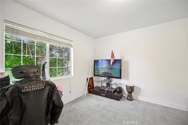 a view of a livingroom with a car parked in it