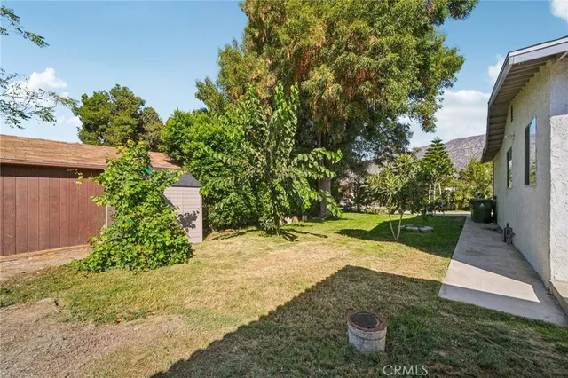 a view of a patio with table and chairs and potted plants