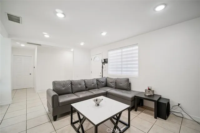 a kitchen with cabinets appliances a sink and a counter top space