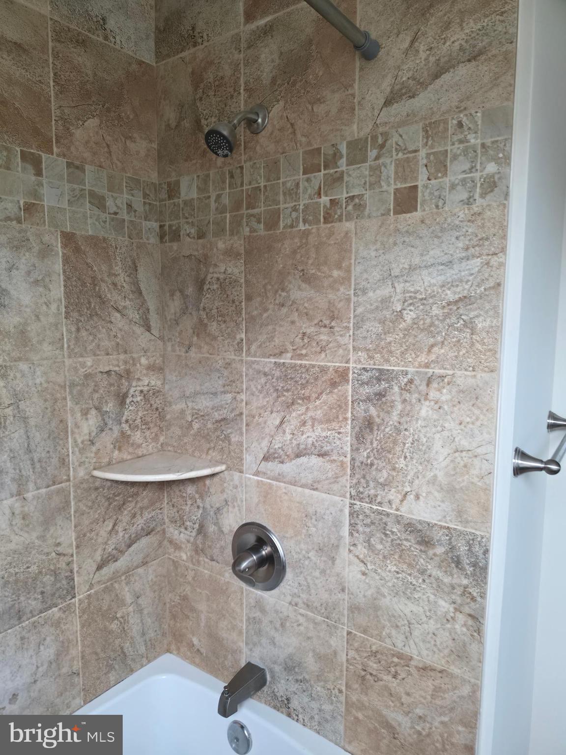 2028 Hillenwood Road Baltimore, MD 21239 - Photo 13 of 18 a bathroom with a shower
