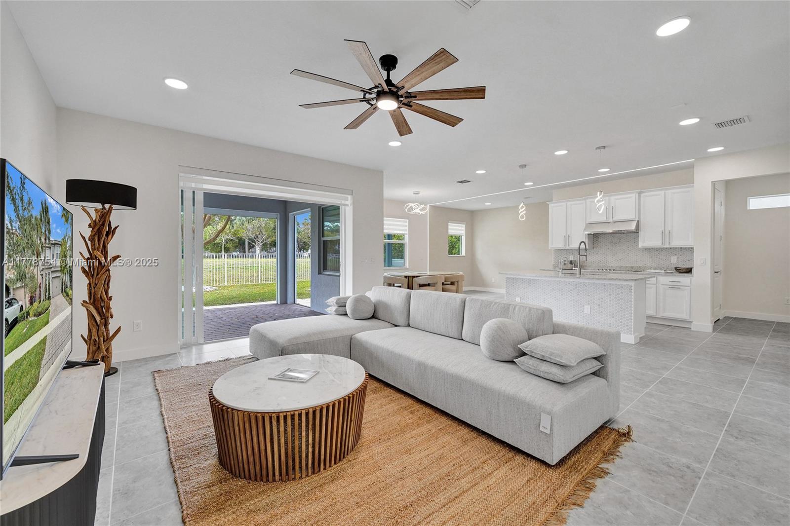 1348 Silk Oak Drive Hollywood, FL 33021 - Photo 1 of 100 a living room with furniture and a view of kitchen