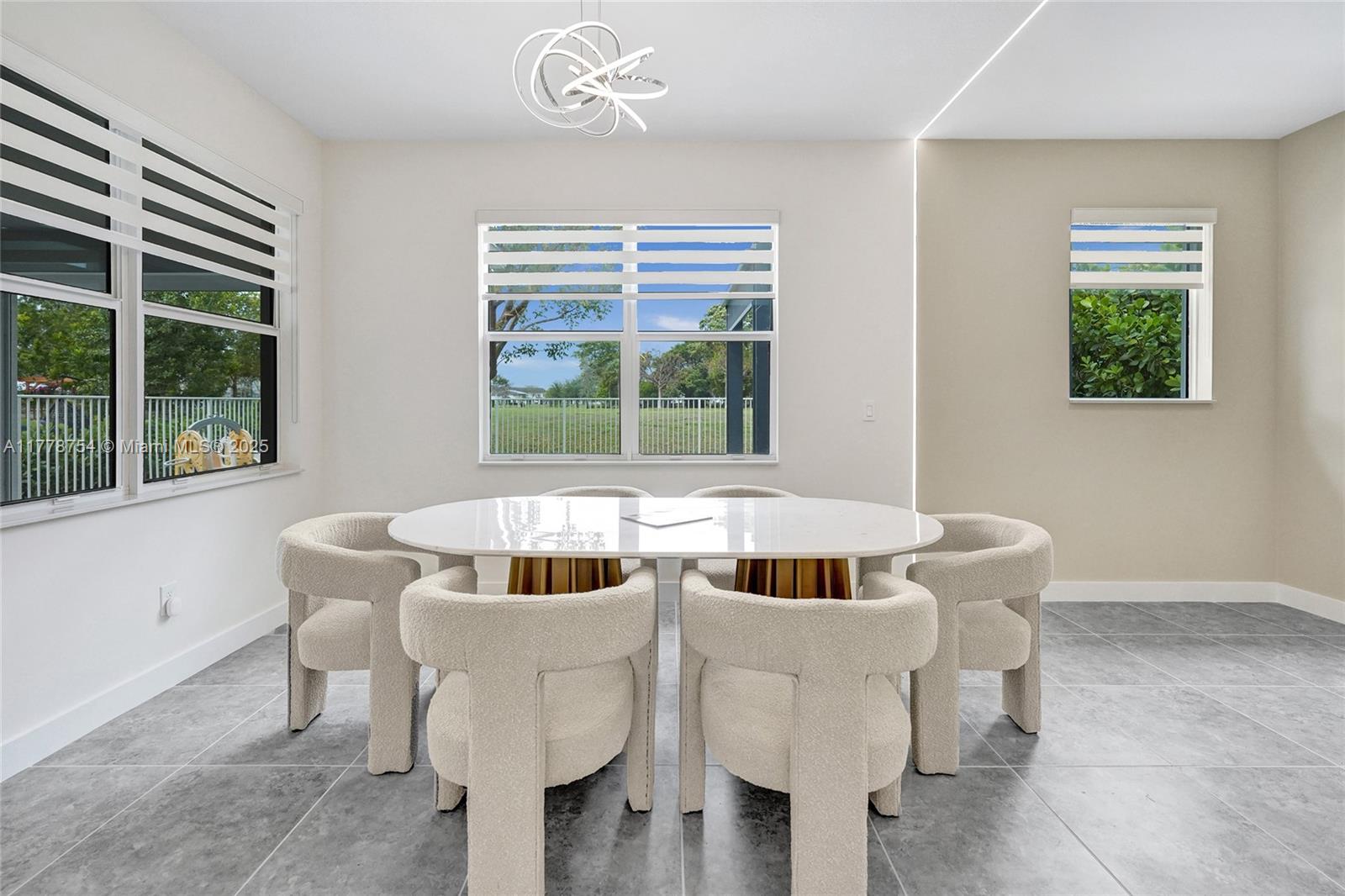 1348 Silk Oak Drive Hollywood, FL 33021 - Photo 34 of 100 a living room with furniture and a potted plant