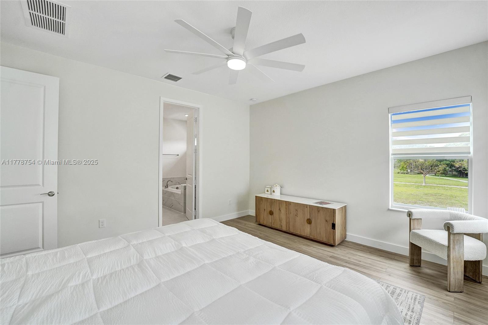 1348 Silk Oak Drive Hollywood, FL 33021 - Photo 42 of 100 a bedroom with a bed and a window