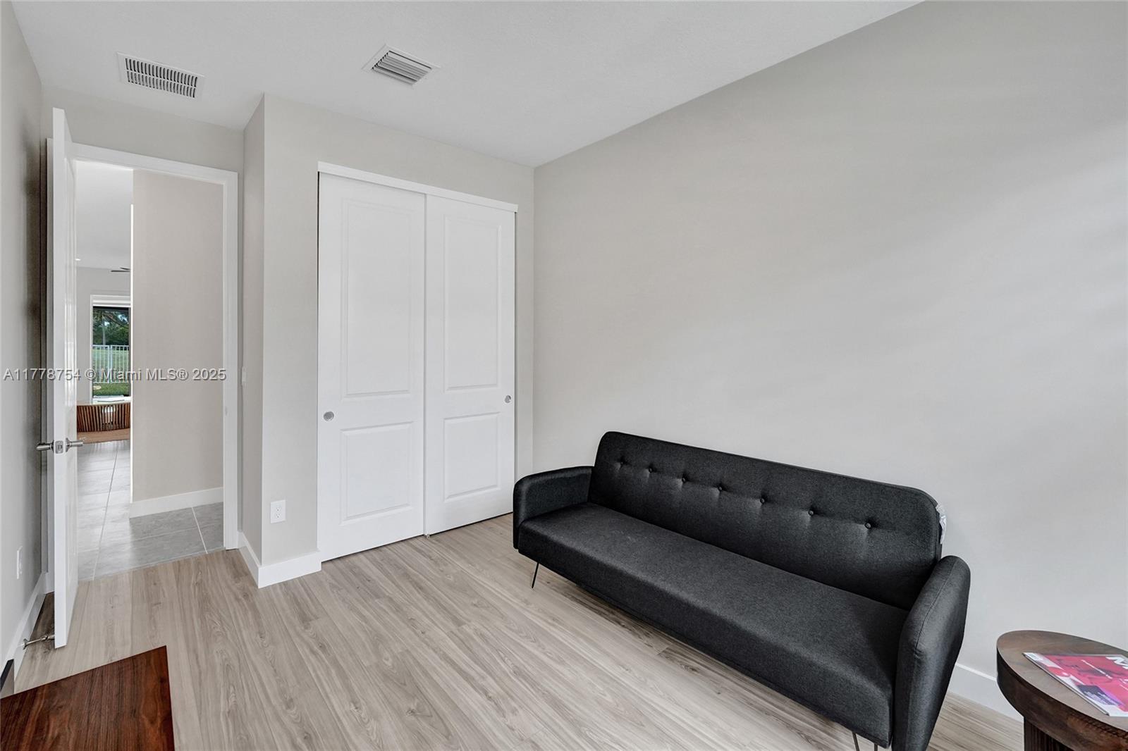 1348 Silk Oak Drive Hollywood, FL 33021 - Photo 5 of 100 a living room with furniture and a couch