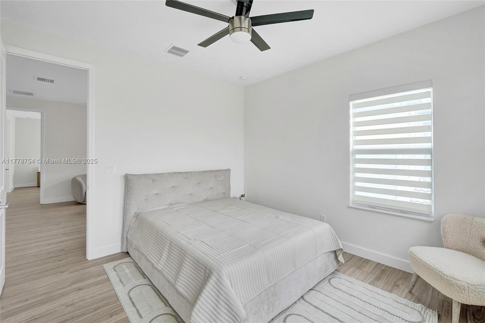 1348 Silk Oak Drive Hollywood, FL 33021 - Photo 55 of 100 a bedroom with a bed and a window