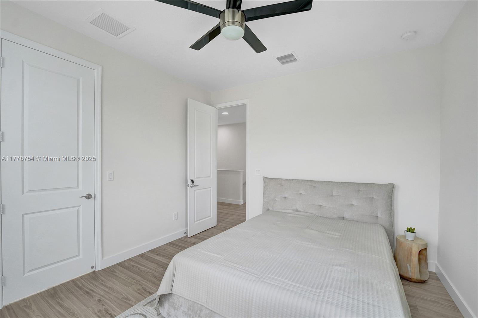 1348 Silk Oak Drive Hollywood, FL 33021 - Photo 56 of 100 a bedroom with a bed and a ceiling fan