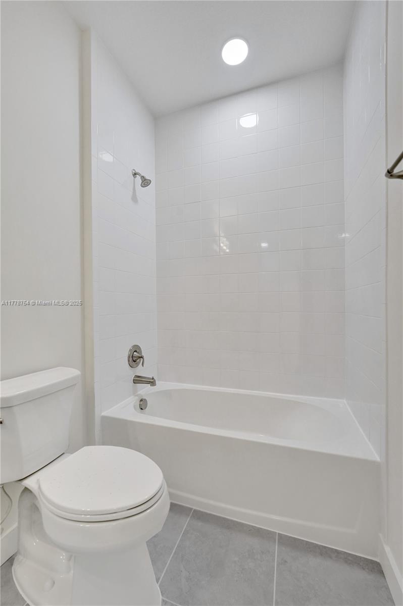 1348 Silk Oak Drive Hollywood, FL 33021 - Photo 61 of 100 a bathroom with a toilet and a bath tub