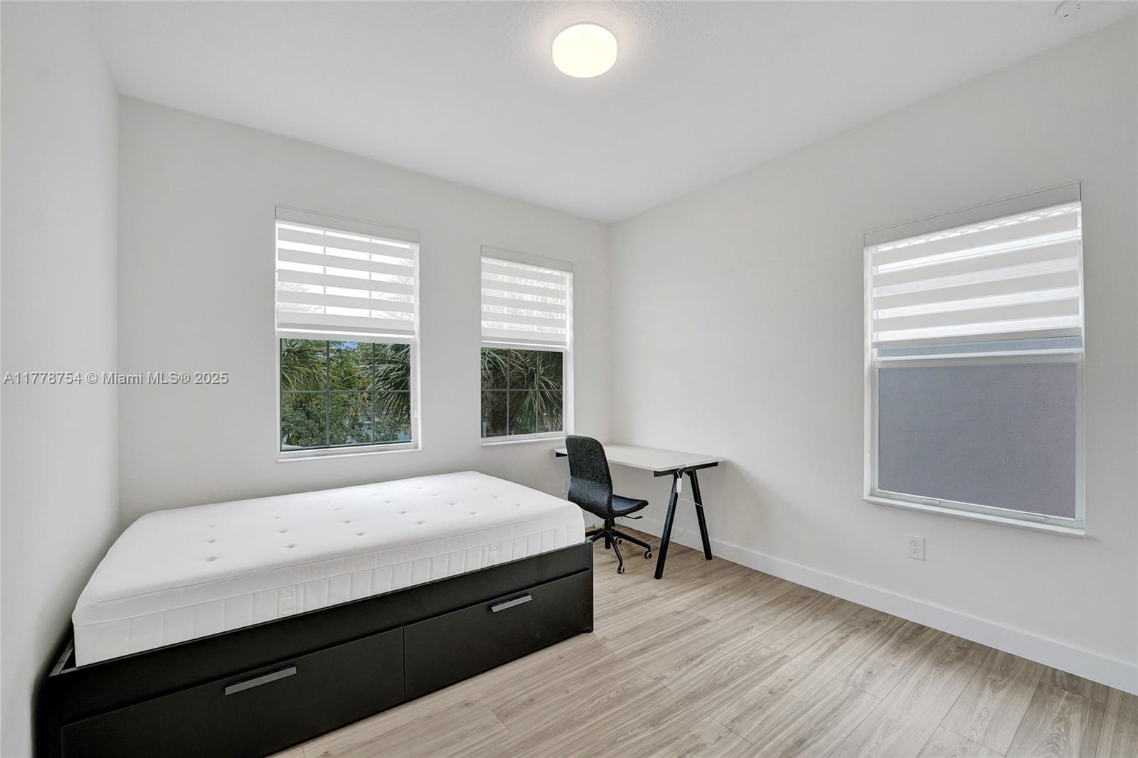 1348 Silk Oak Drive Hollywood, FL 33021 - Photo 65 of 100 a bedroom with a bed and a window