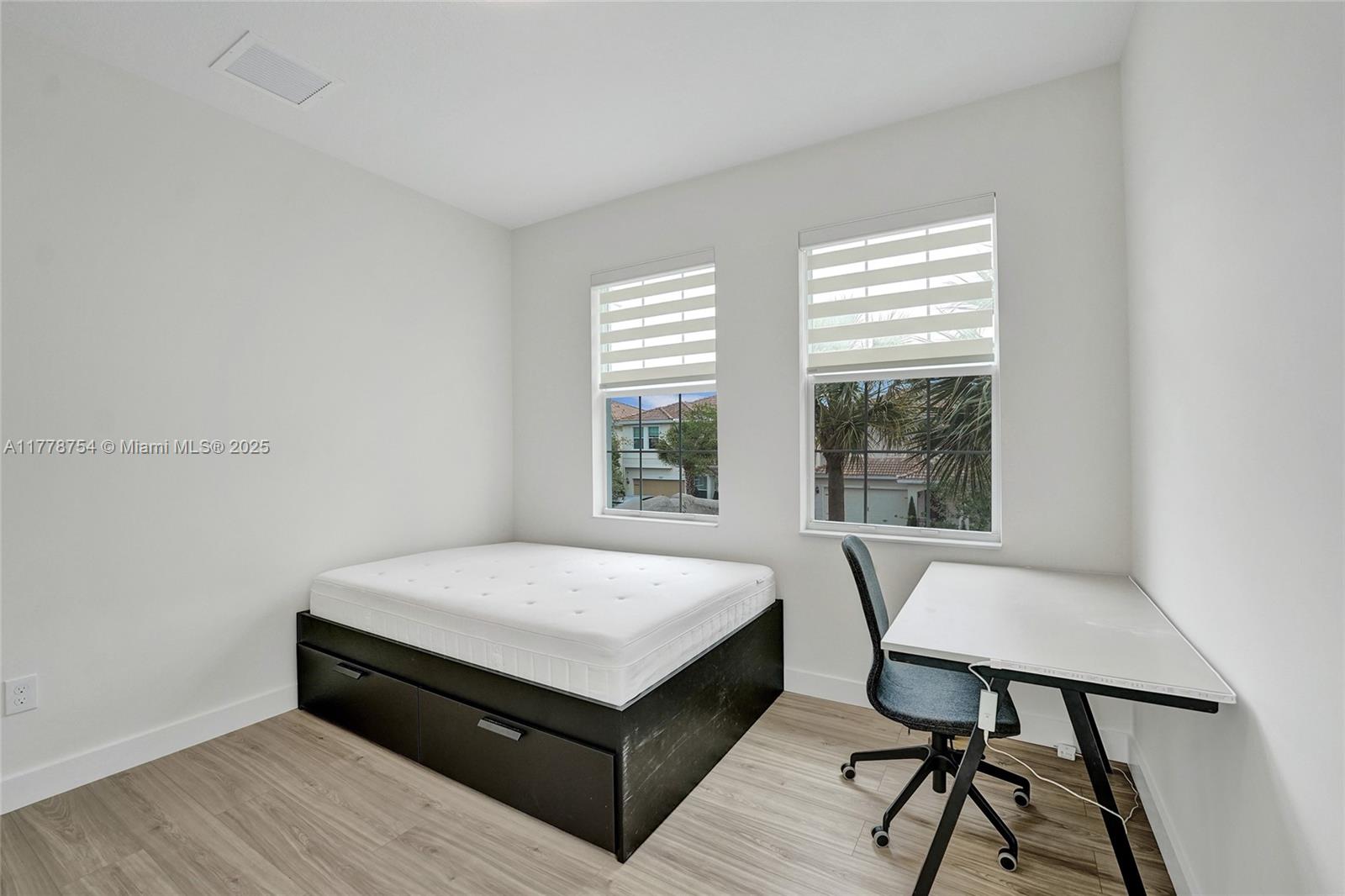 1348 Silk Oak Drive Hollywood, FL 33021 - Photo 66 of 100 a room with a bed and a table in it