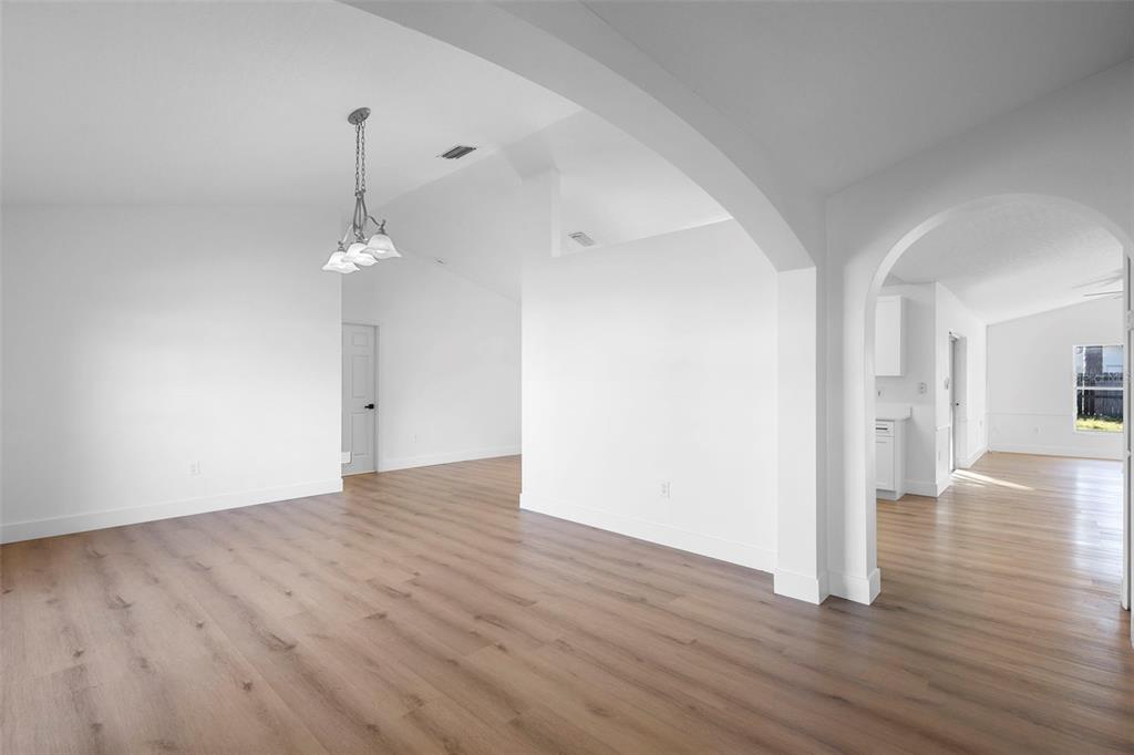 4395 Comfort Street Cocoa, FL 32927 - Photo 12 of 44 a view of an empty room with wooden floor