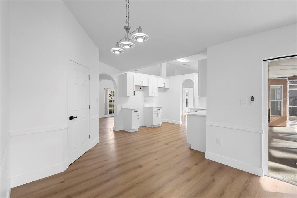 4395 Comfort Street Cocoa, FL 32927 - Photo 19 of 44 a view of a kitchen with refrigerator and wooden floor