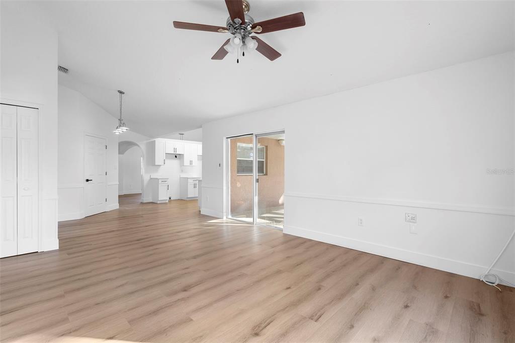 4395 Comfort Street Cocoa, FL 32927 - Photo 23 of 44 an empty room with wooden floor and windows