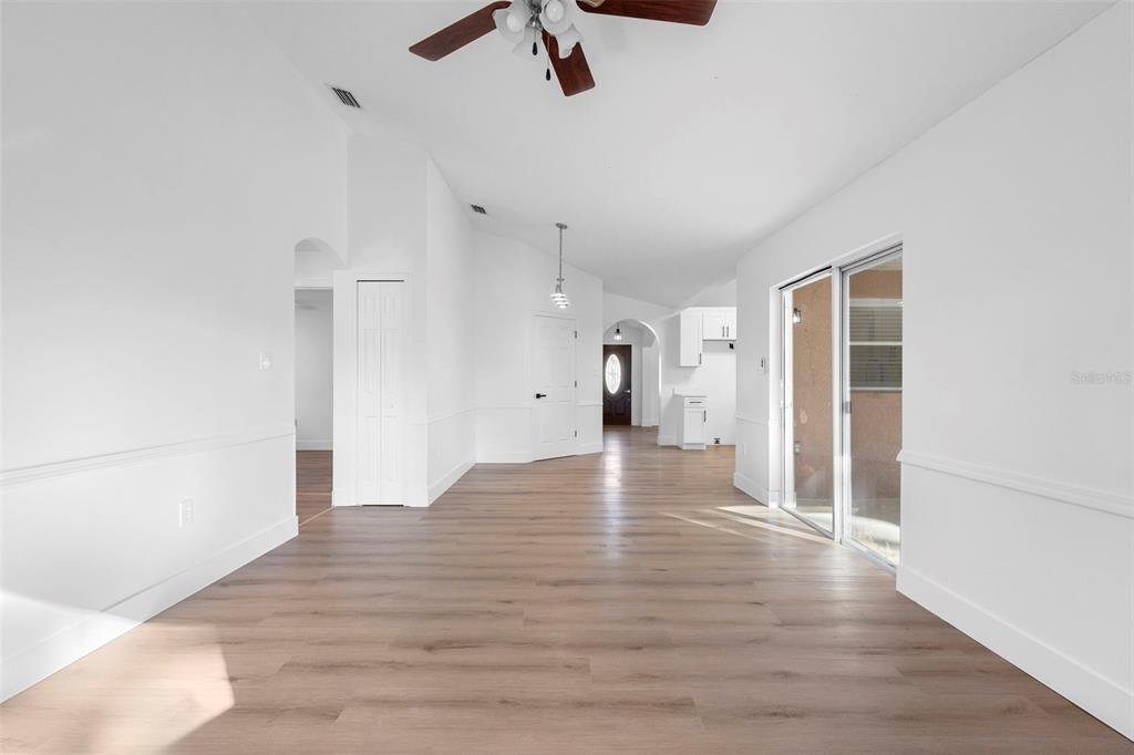 4395 Comfort Street Cocoa, FL 32927 - Photo 24 of 44 a view of an empty room with wooden floor and a window