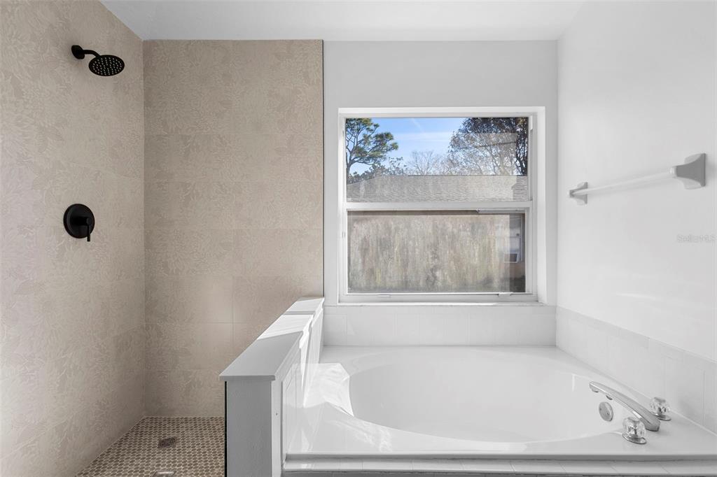 4395 Comfort Street Cocoa, FL 32927 - Photo 30 of 44 a white bath tub sitting next to a window