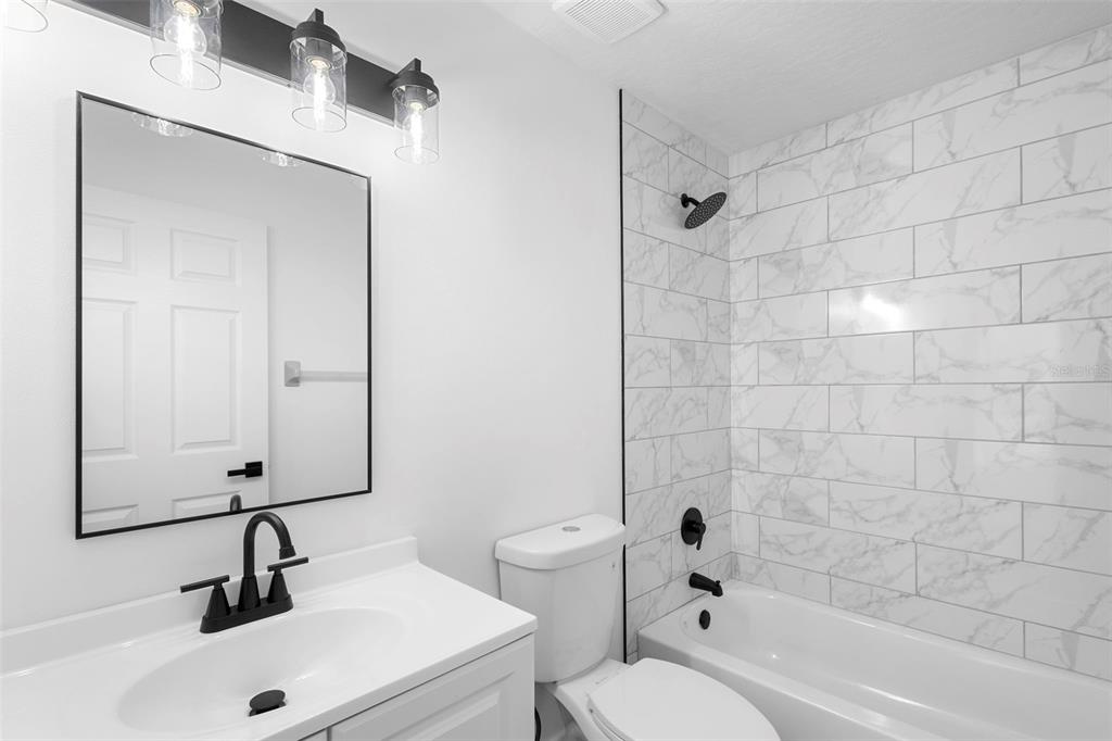 4395 Comfort Street Cocoa, FL 32927 - Photo 31 of 44 a bathroom with a sink a toilet and shower