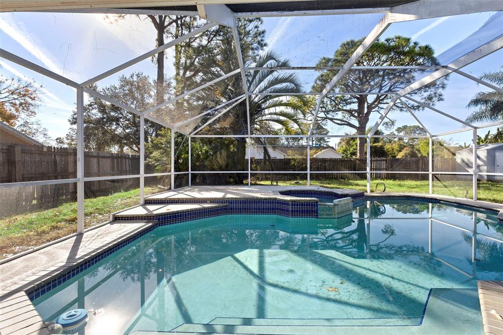 4395 Comfort Street Cocoa, FL 32927 - Photo 37 of 44 a view of swimming pool with seating area and deck in the back