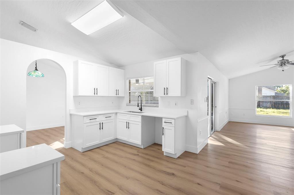 4395 Comfort Street Cocoa, FL 32927 - Photo 9 of 44 a kitchen with a sink cabinets and wooden floor