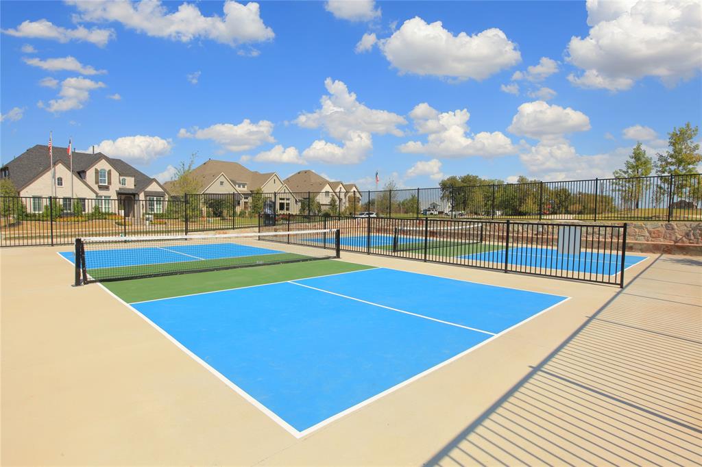 1406 Potenza Road Fate, TX 75087 - Photo 12 of 23 a view of an outdoor space and swimming pool