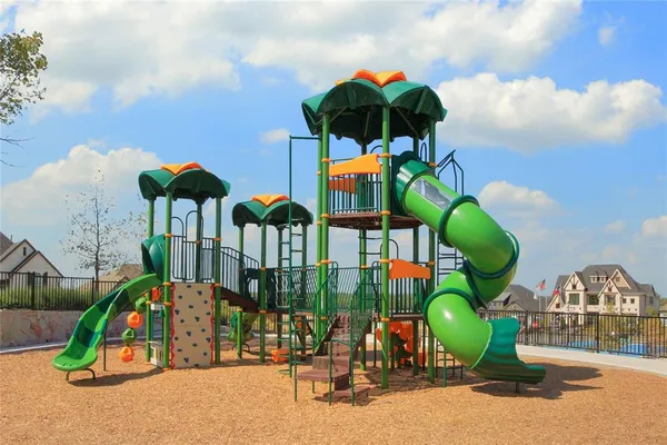 a childrens park with lots of swings and slides