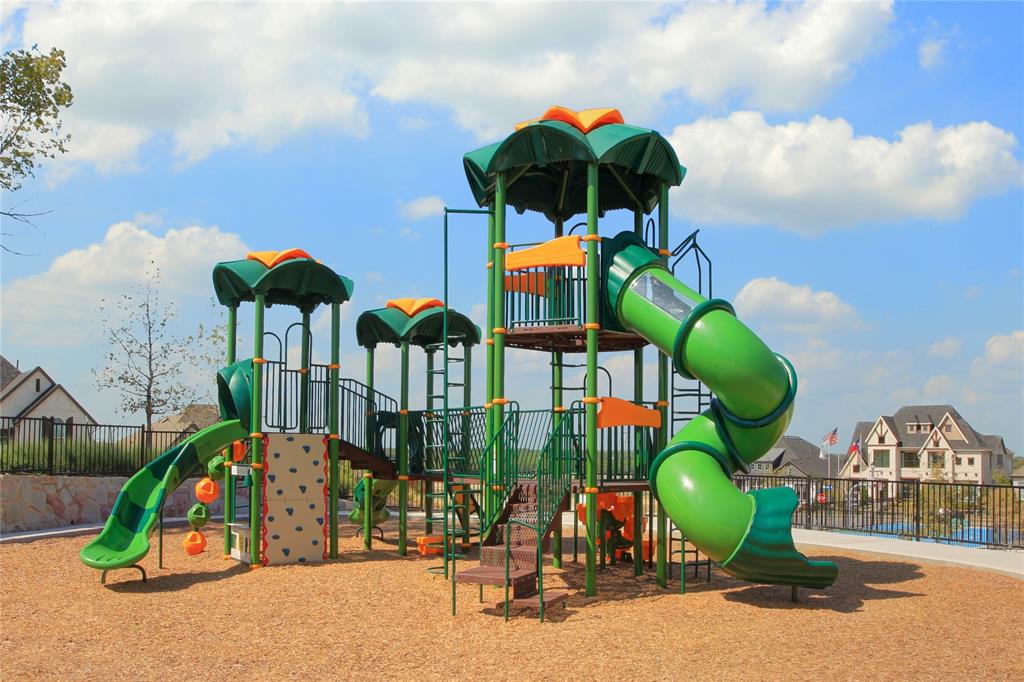 1406 Potenza Road Fate, TX 75087 - Photo 14 of 23 a childrens park with lots of swings and slides
