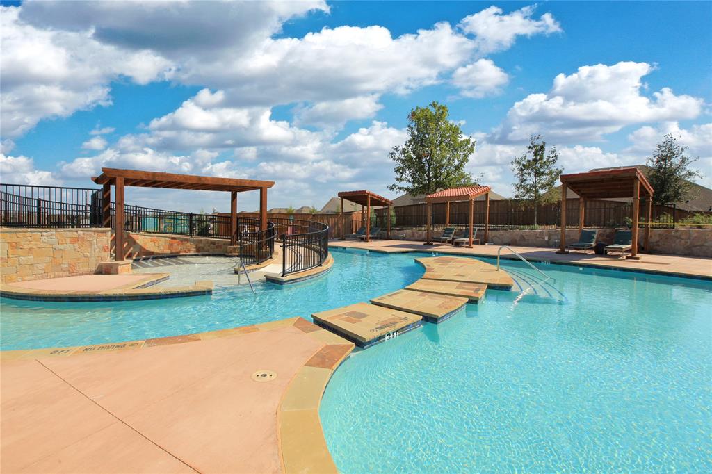 1406 Potenza Road Fate, TX 75087 - Photo 16 of 23 an aerial view of a house with swimming pool garden and lake view