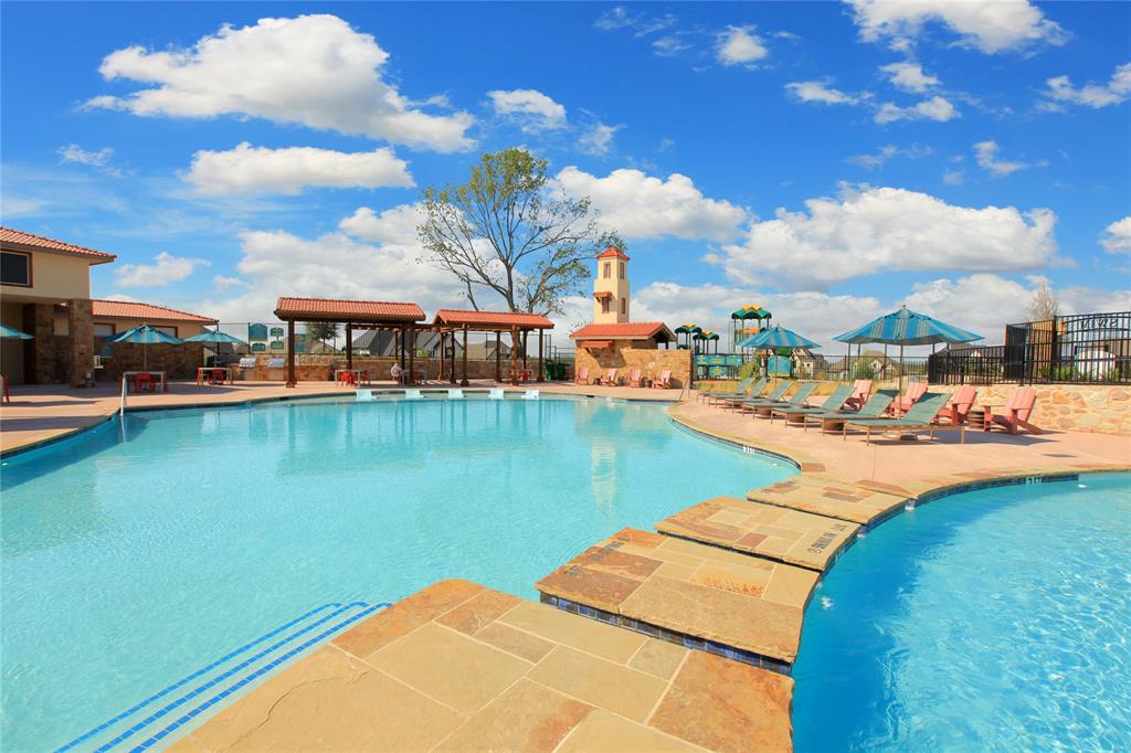 1406 Potenza Road Fate, TX 75087 - Photo 17 of 23 a view of a lake with lawn chairs